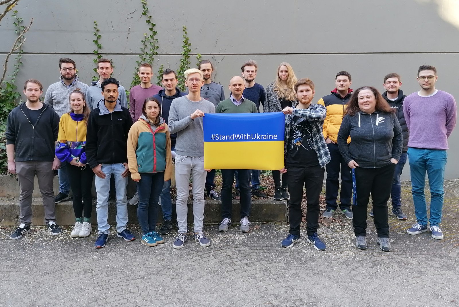members of Delius research group with a Ukrainian flag